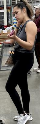 Costco Sighting - Latina on Phone in Check Out Line