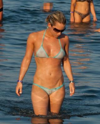 Wearing transparent tiny bikini on public beach...