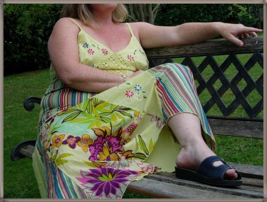 Milf teasing in yellow dress outdoors