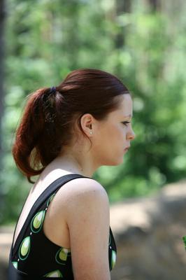 Young girl takes a pee in the forest