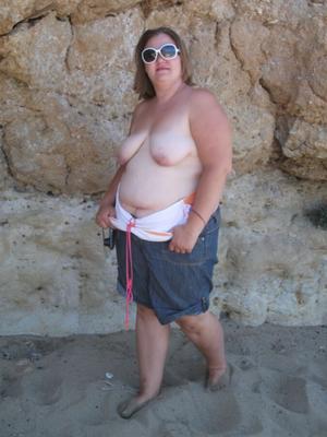 fat ex wife on a beach in spain