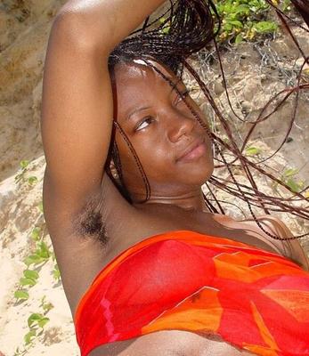 Coco, ebony girl showing hairy armpits and pussy