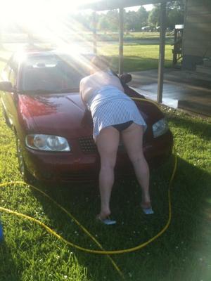 Leah washing the car