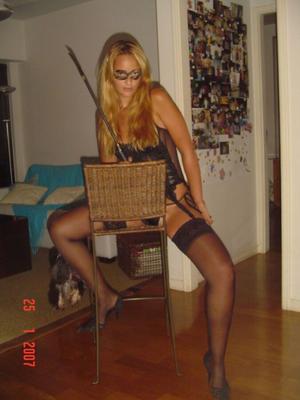 Masked blonde in stockings