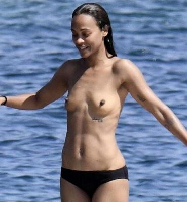 Zoe Saldana with her little tits out on the ocean